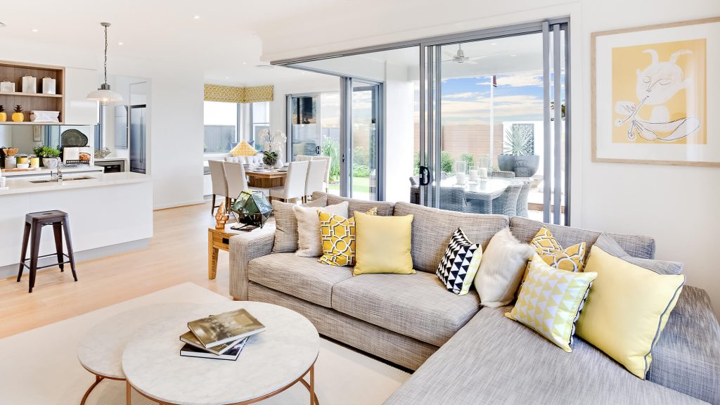 living room of a house open on the kitchen, the dining room and the terrace