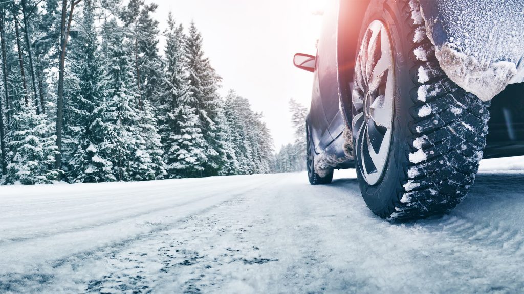 Close-up of winter tyres in the snow